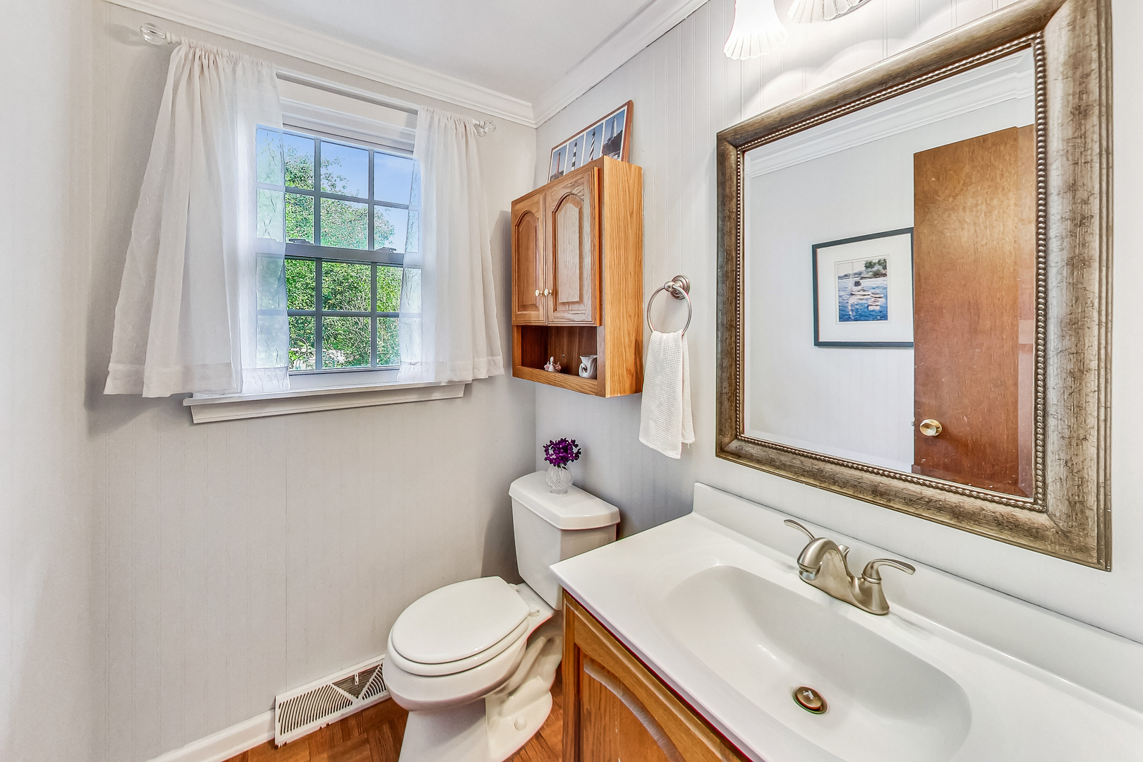 544 Northgate Road Lindenhurst, IL 60046 - Photo 16 of 32 a bathroom with a sink toilet and mirror