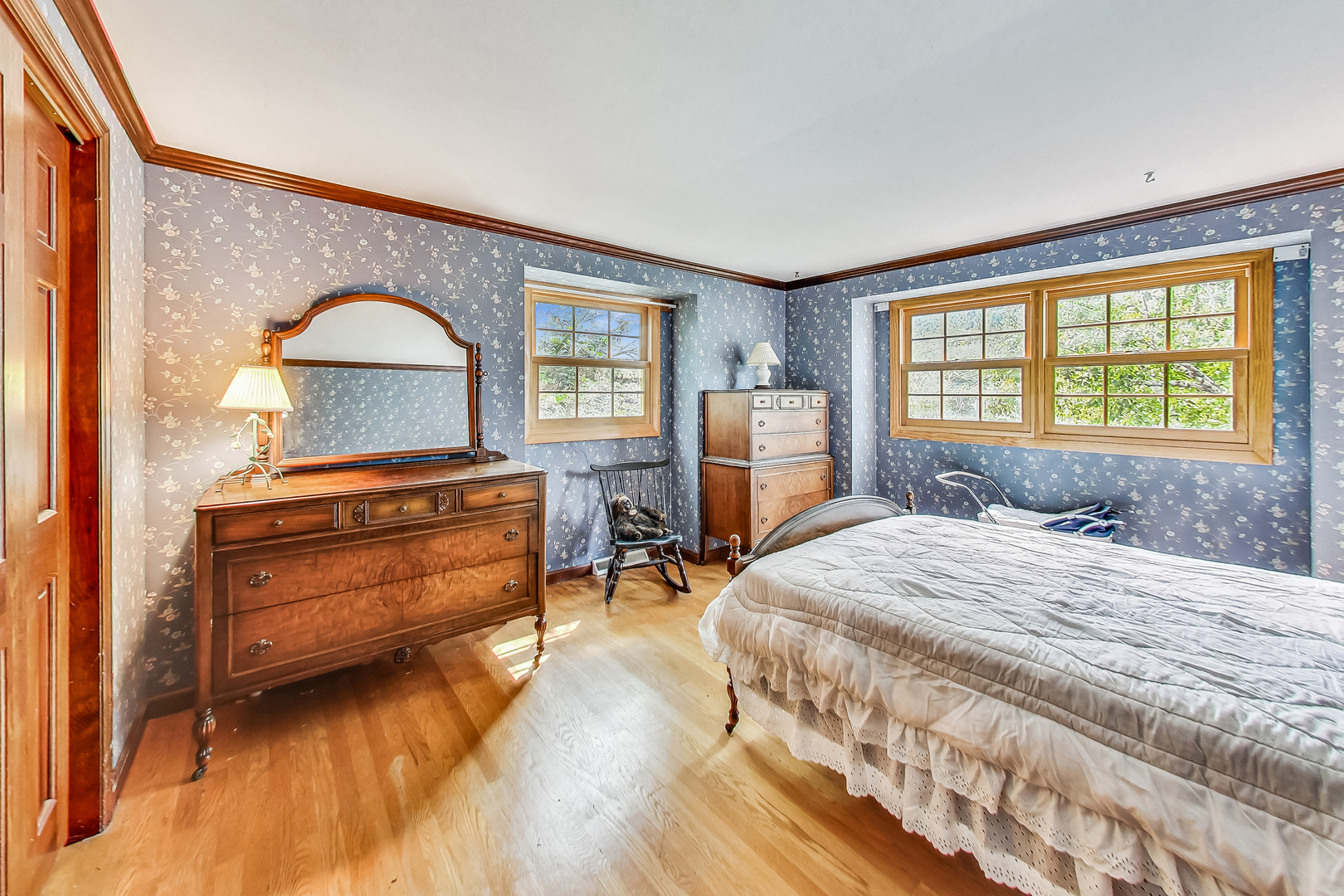 544 Northgate Road Lindenhurst, IL 60046 - Photo 21 of 32 a bedroom with a bed and a dresser next to a window