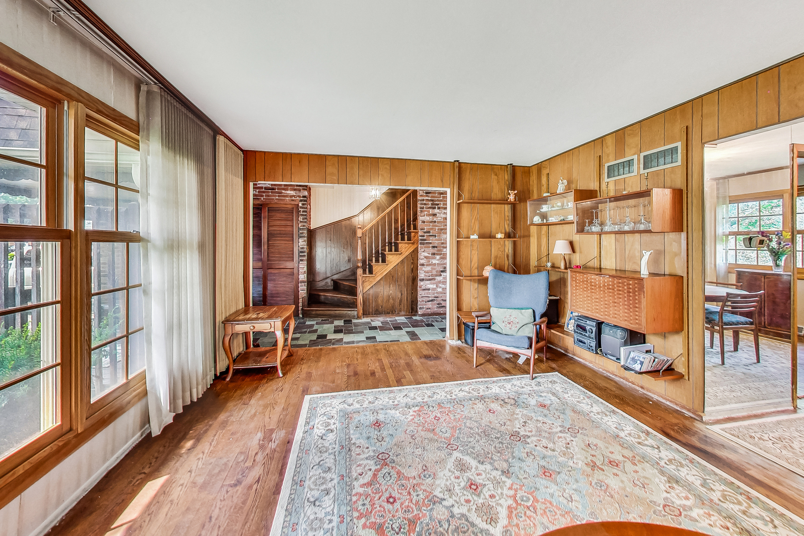 544 Northgate Road Lindenhurst, IL 60046 - Photo 5 of 32 a view of an empty room and wooden floor and furniture