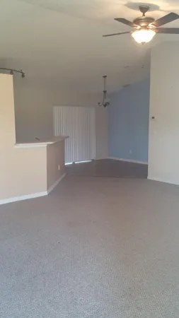 a kitchen with cabinets and utility