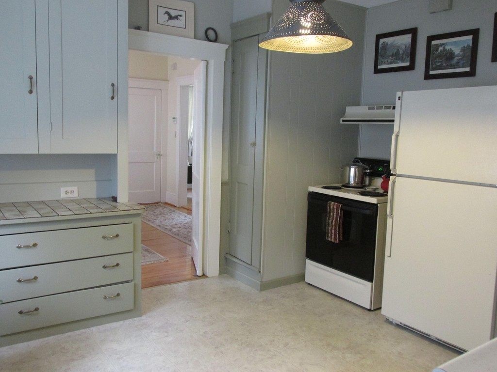 9 Pomona Road Worcester, MA 01602 - Photo 16 of 29 a kitchen with a refrigerator and a stove