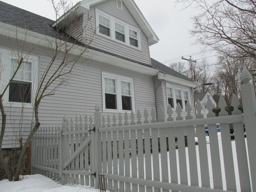 9 Pomona Road Worcester, MA 01602 - Photo 3 of 29 a front view of a house with fence