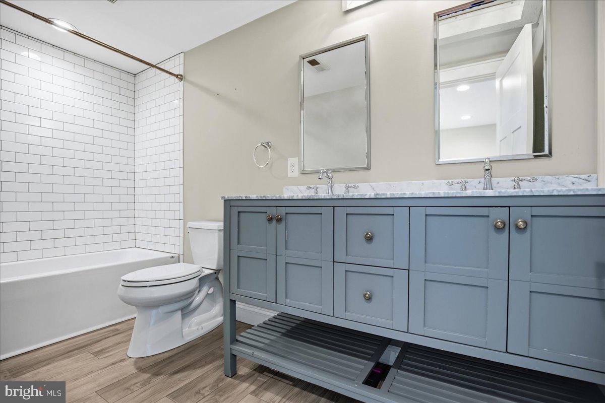 16146 Thomas Road Piney Point, MD 20674 - Photo 41 of 70 a bathroom with a sink a toilet and mirror