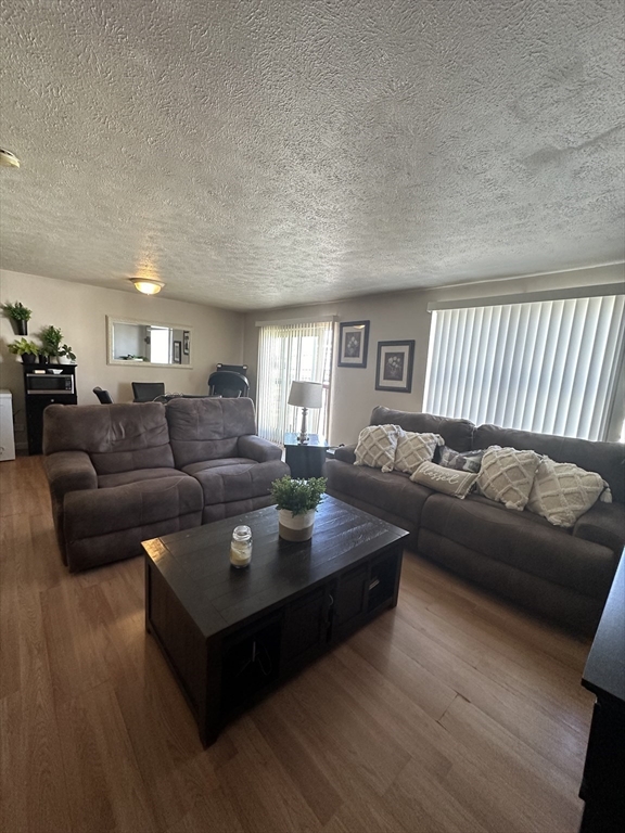 20 Knox Street, Unit 24 Lawrence, MA 01841 - Photo 2 of 13 a living room with furniture and a couch