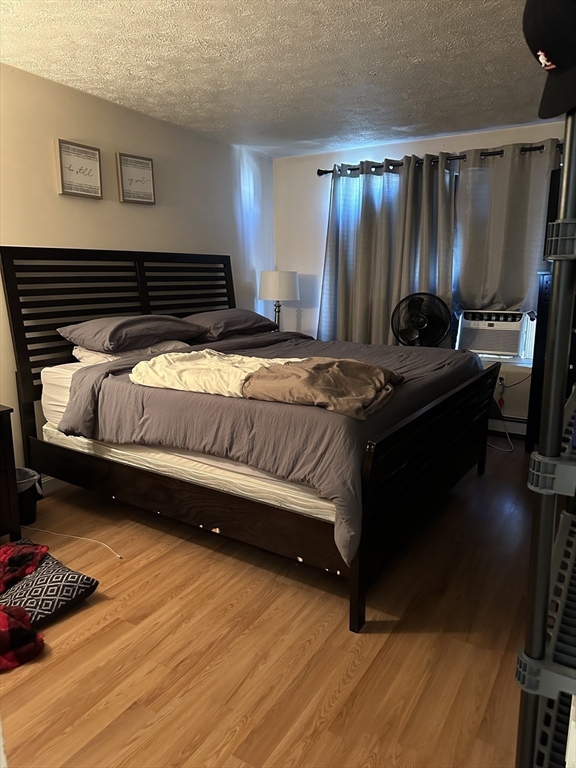 20 Knox Street, Unit 24 Lawrence, MA 01841 - Photo 7 of 13 a bedroom with a bed and a dresser