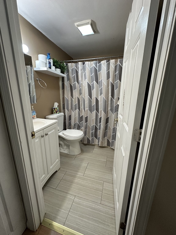 20 Knox Street, Unit 24 Lawrence, MA 01841 - Photo 9 of 13 a bathroom with a sink a toilet a tub and shower