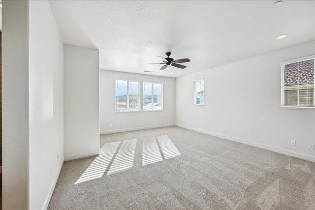 a bathroom with a sink double vanity granite and a large mirror