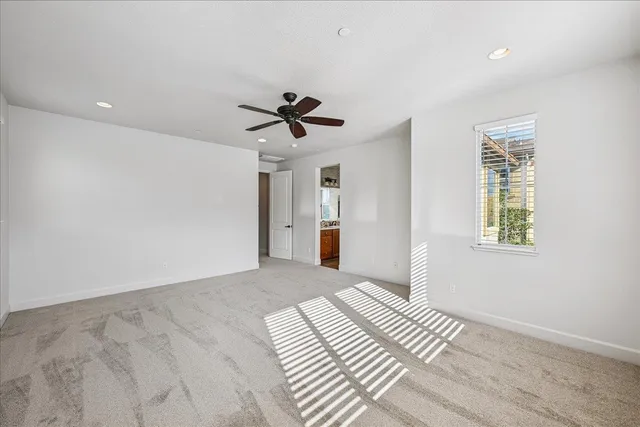 a bathroom with a tub sink shower and a mirror