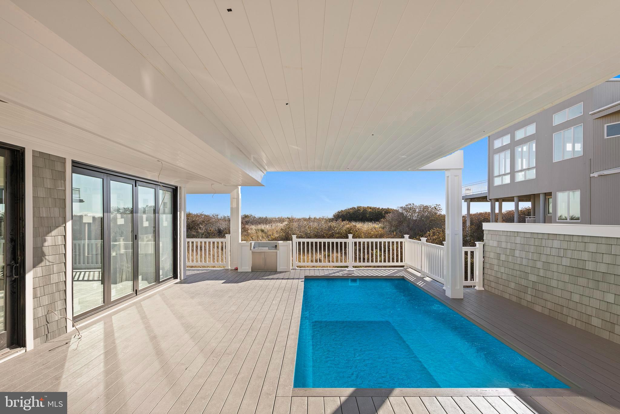 11 East 30th Street Barnegat Light, NJ 08006 - Photo 12 of 28 a living room with furniture and a large window