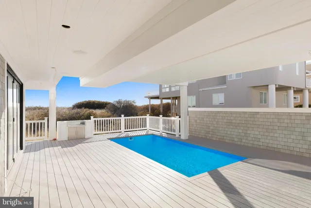 a view of a living room and wooden floor