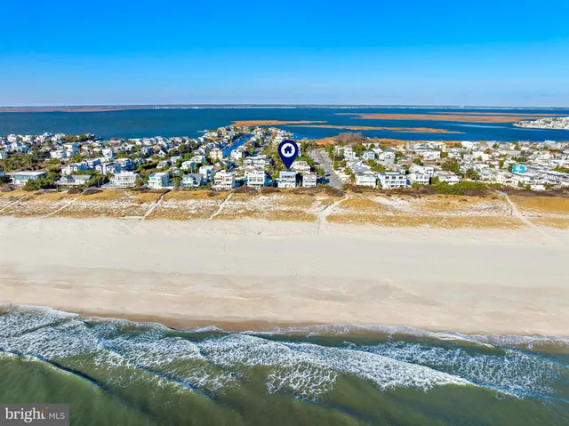 an aerial view of ocean and city