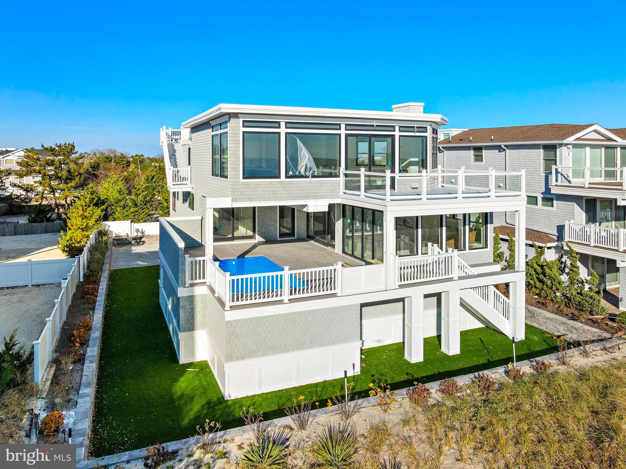 11 East 30th Street Barnegat Light, NJ 08006 - Photo 3 of 28 a front view of a house with a yard