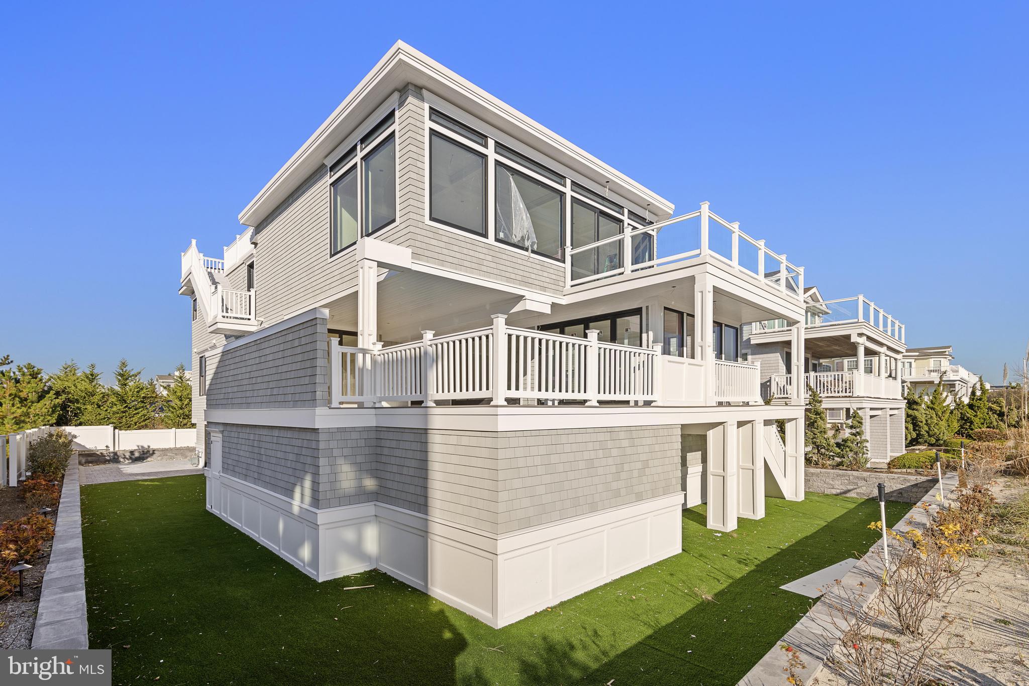 11 East 30th Street Barnegat Light, NJ 08006 - Photo 6 of 28 a front view of a house with a yard