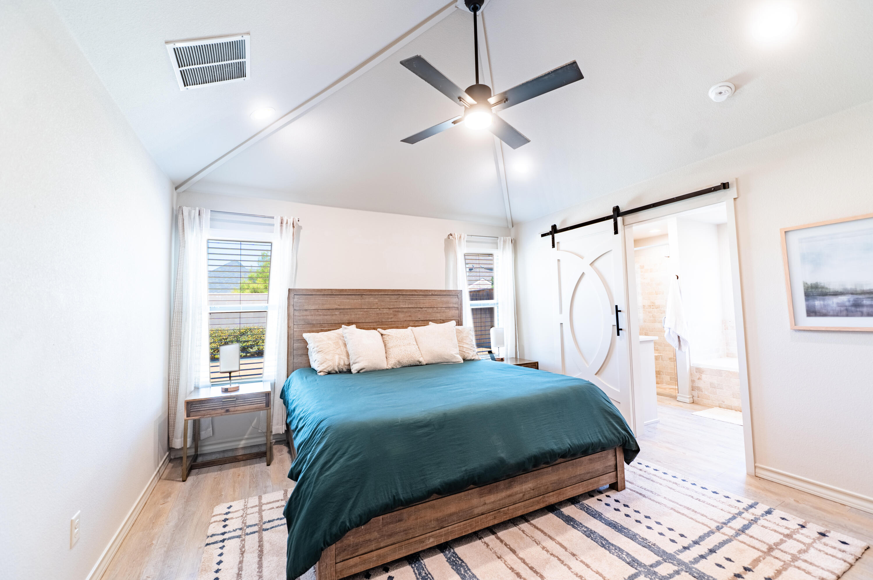 3442 126th Street Lubbock, TX 79423 - Photo 16 of 53 a bedroom with a large bed and a window