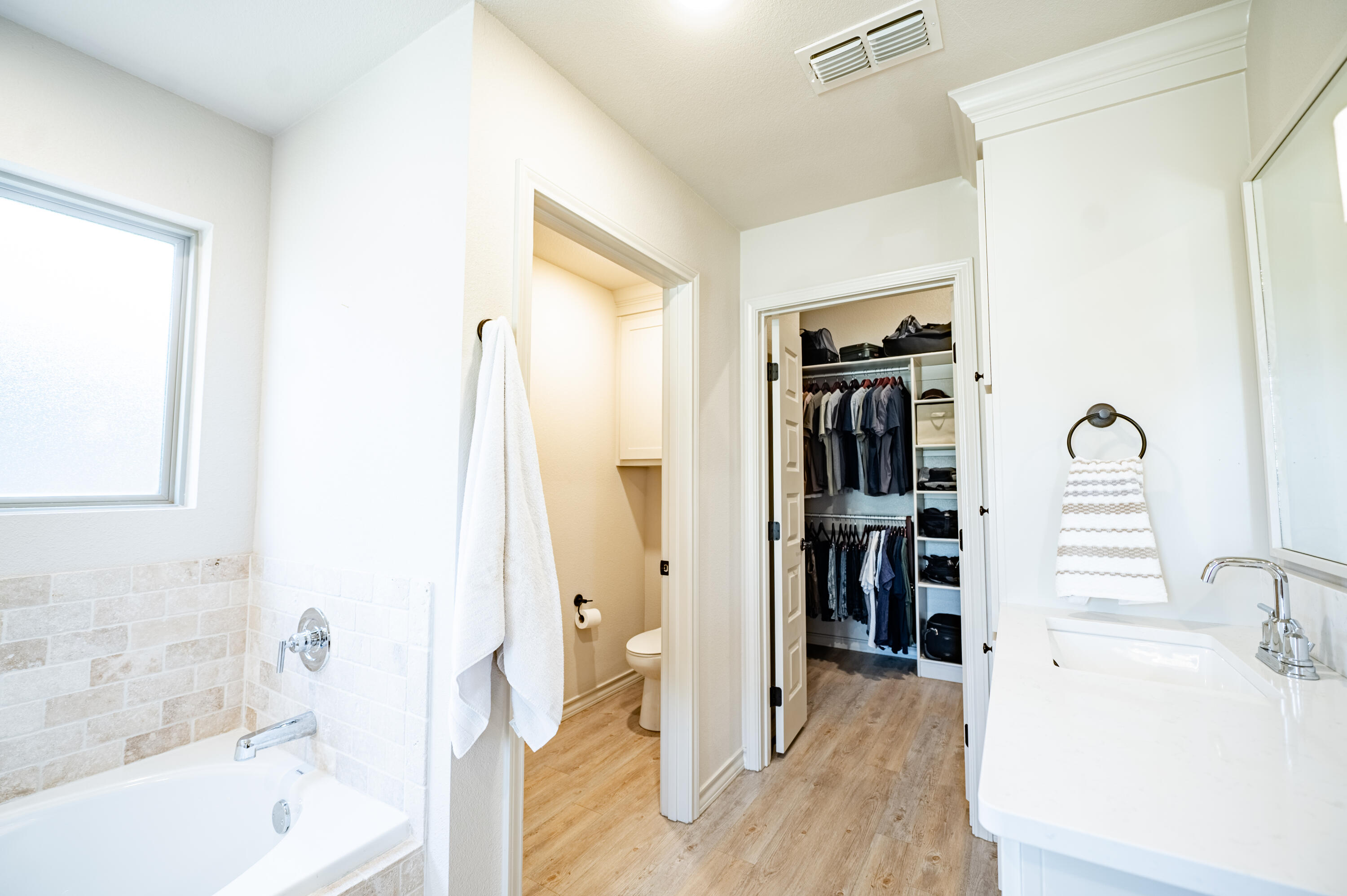 3442 126th Street Lubbock, TX 79423 - Photo 18 of 53 a bathroom with a tub shower and a sink