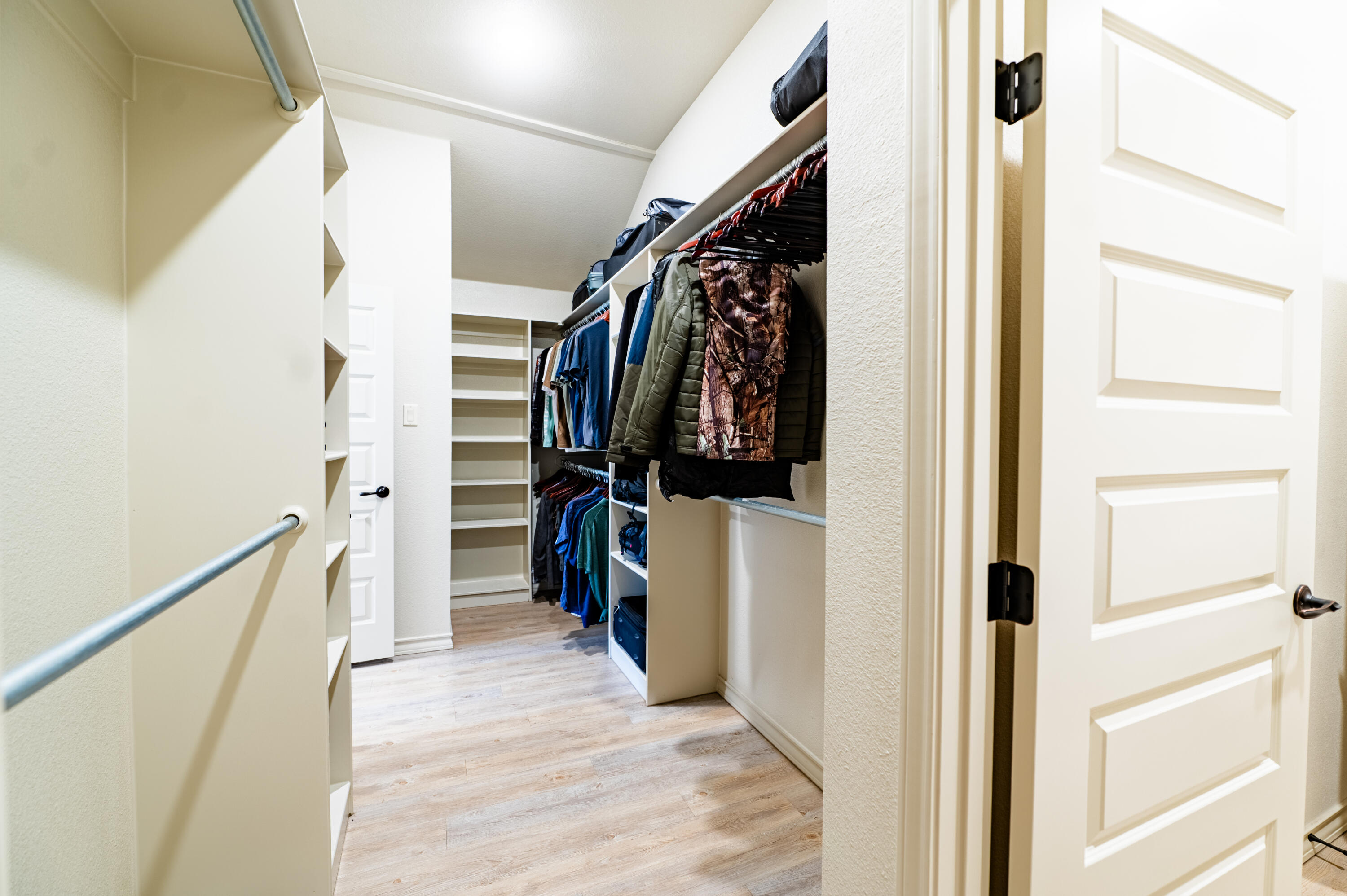 3442 126th Street Lubbock, TX 79423 - Photo 20 of 53 a view of walk in closet with clothes and shoes