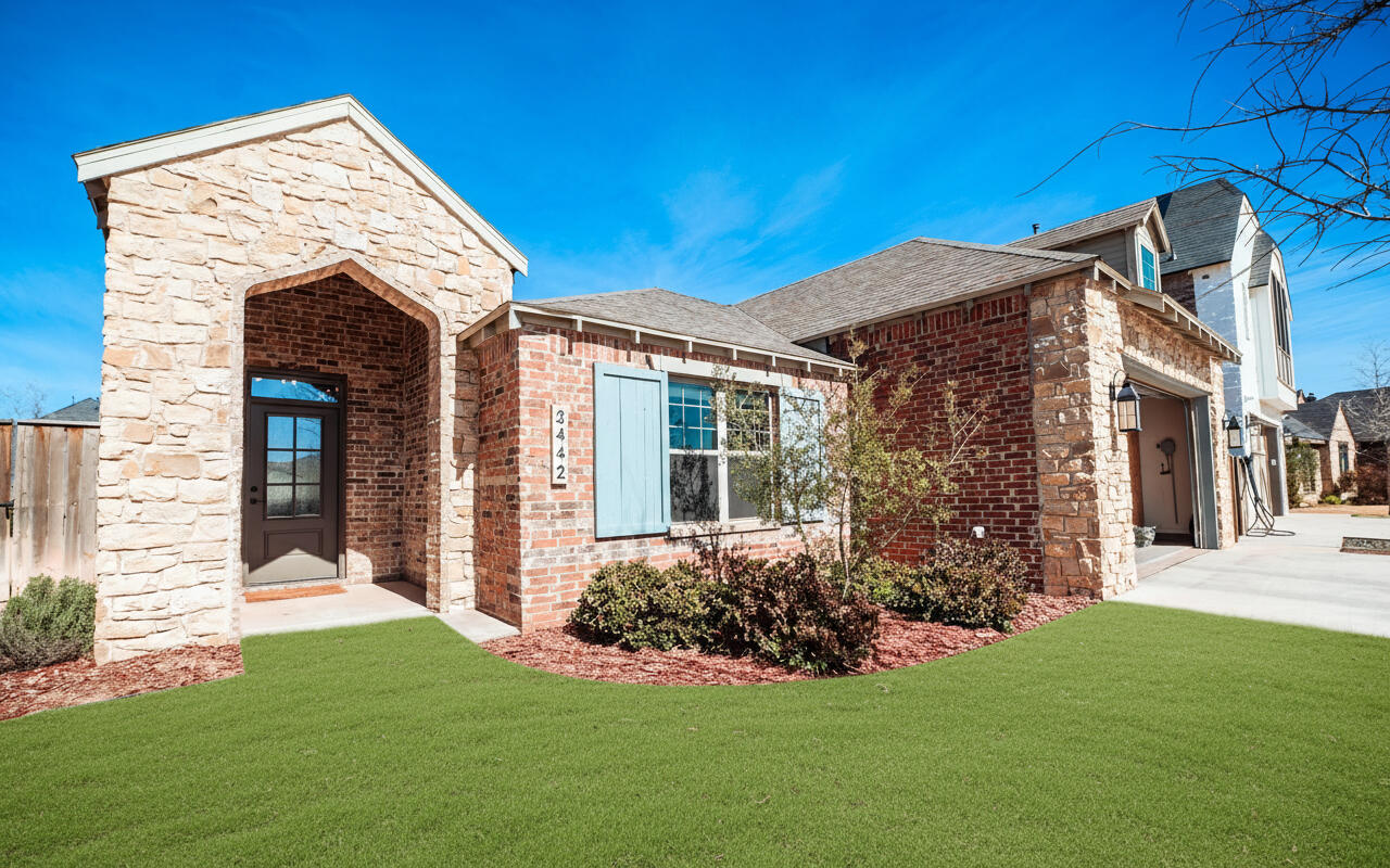 3442 126th Street Lubbock, TX 79423 - Photo 2 of 53 a front view of a house with garden