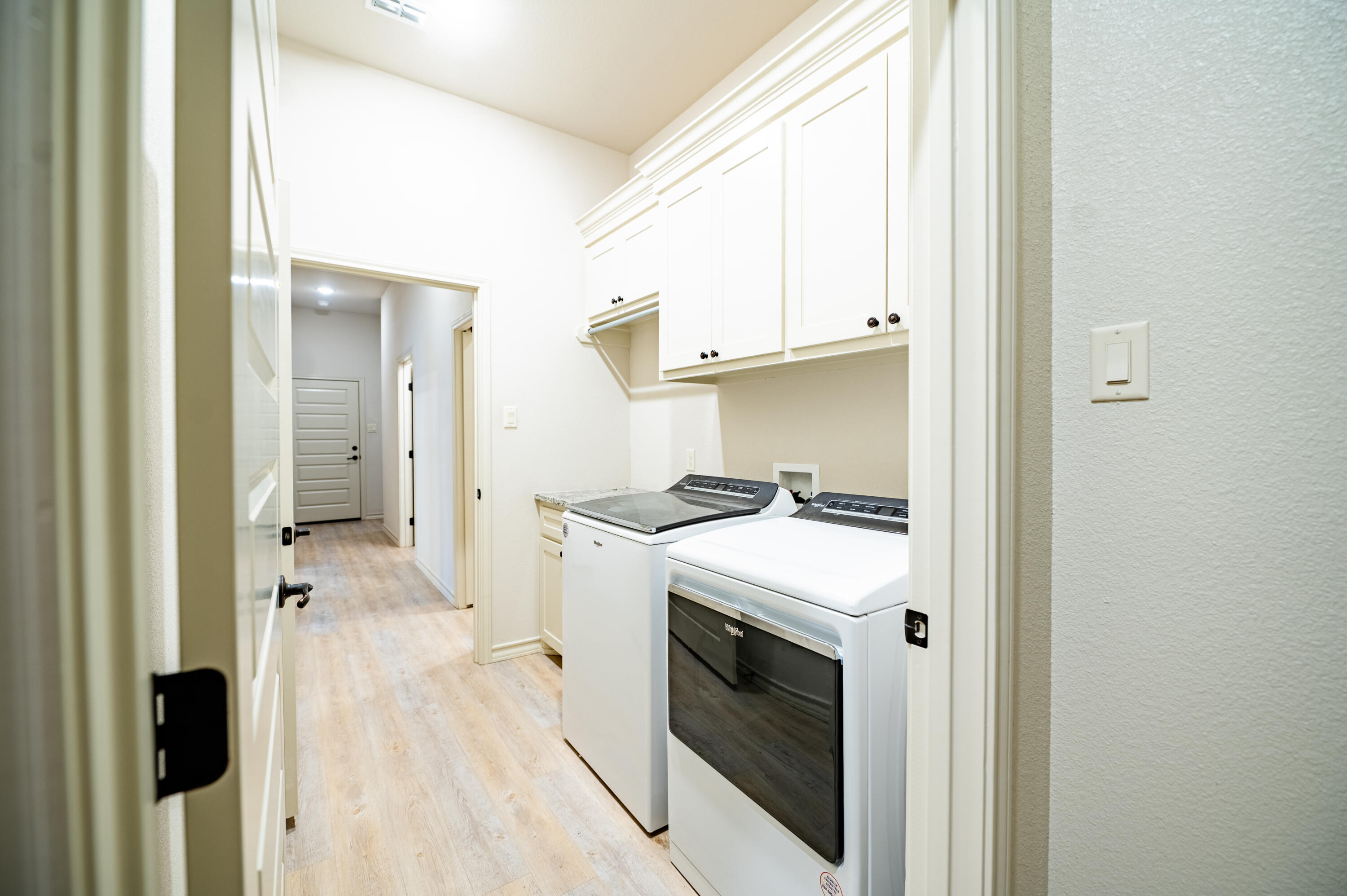 3442 126th Street Lubbock, TX 79423 - Photo 21 of 53 a kitchen with a stove a sink and a refrigerator