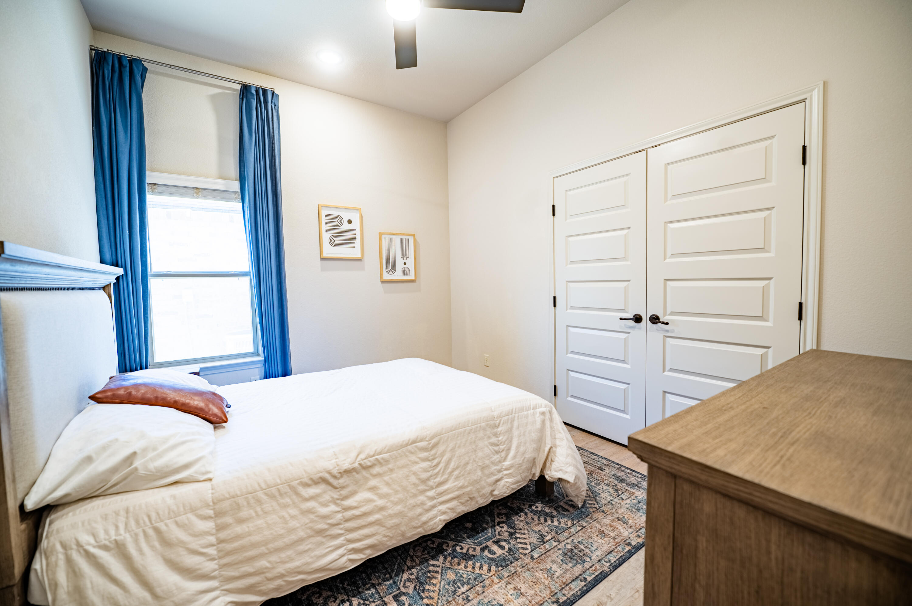 3442 126th Street Lubbock, TX 79423 - Photo 24 of 53 a bedroom with a bed and a dresser