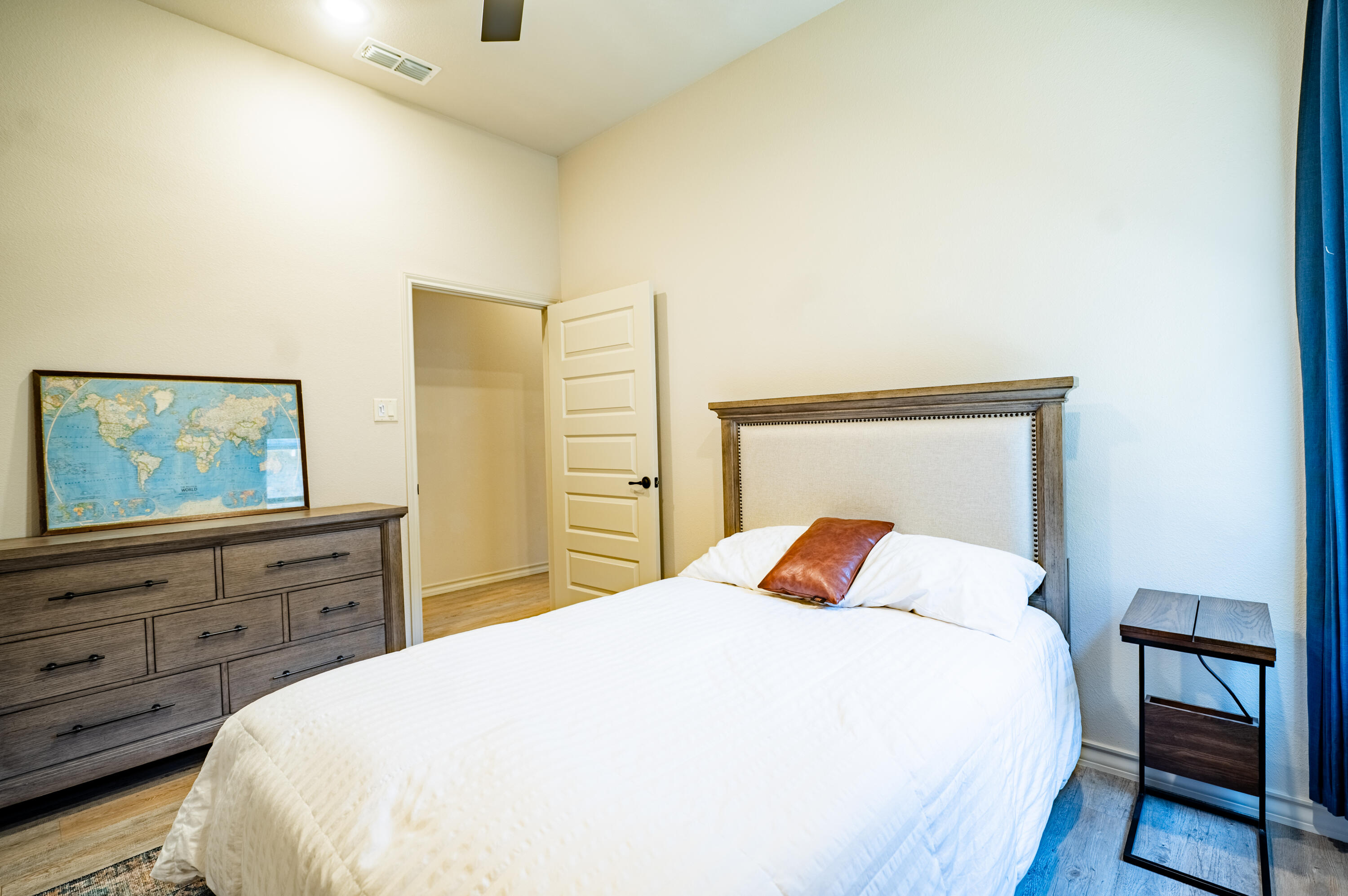 3442 126th Street Lubbock, TX 79423 - Photo 25 of 53 a bedroom with a bed and dresser