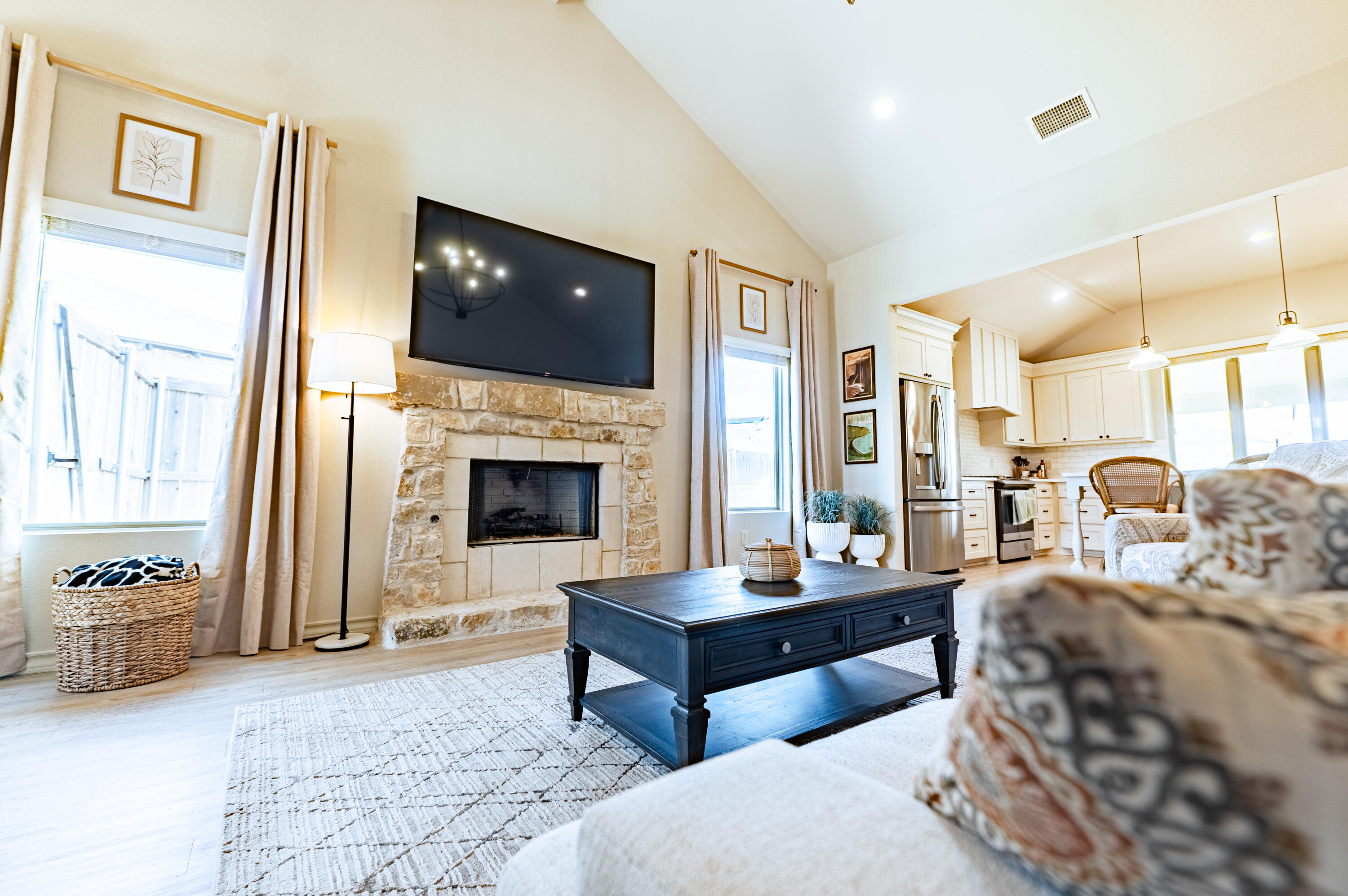 3442 126th Street Lubbock, TX 79423 - Photo 32 of 53 a living room with furniture and a fireplace