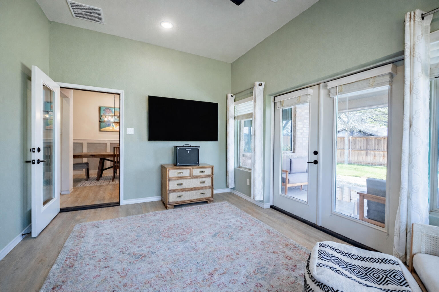 3442 126th Street Lubbock, TX 79423 - Photo 40 of 53 a bedroom with furniture and a flat screen tv