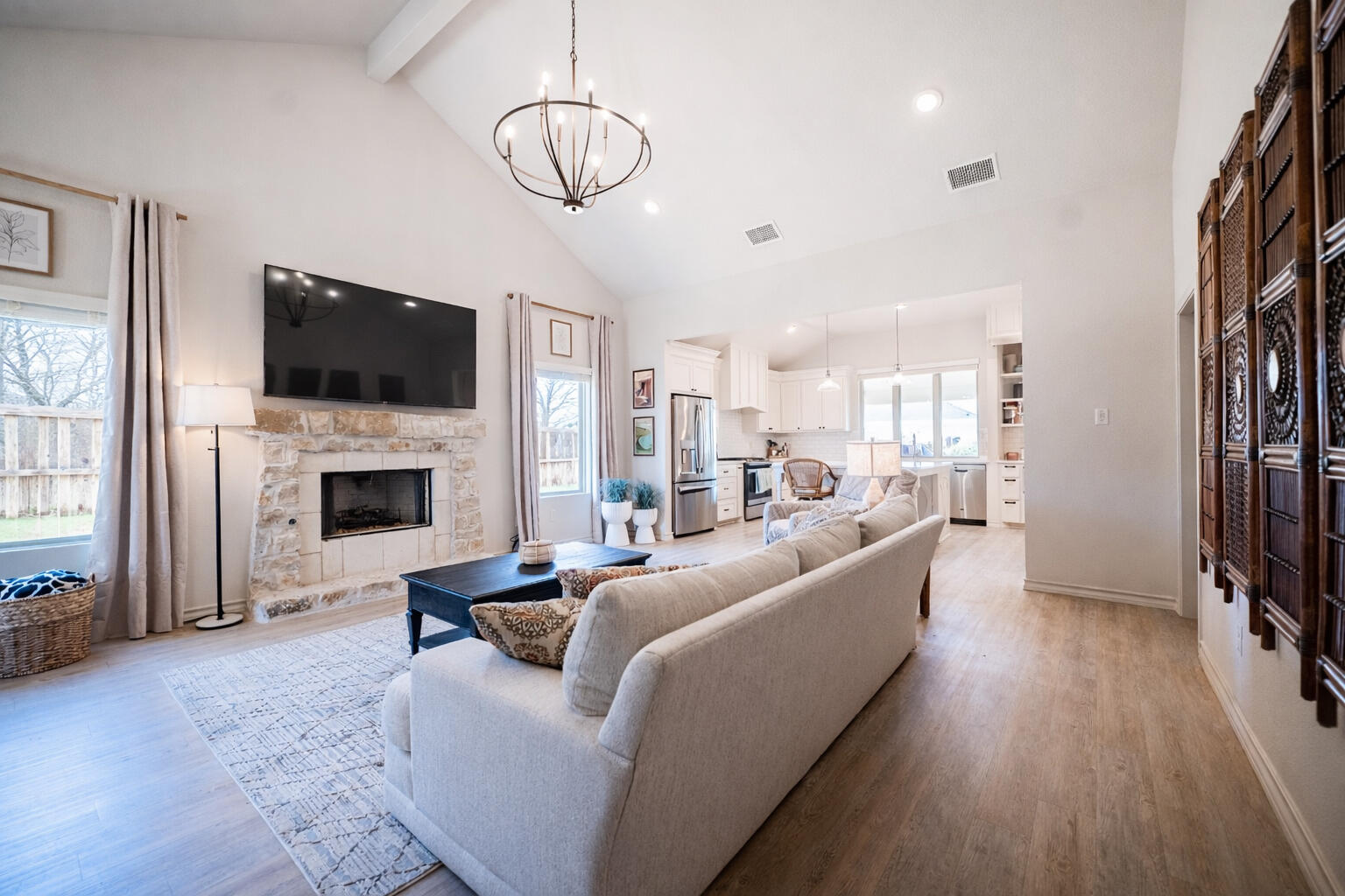 3442 126th Street Lubbock, TX 79423 - Photo 42 of 53 a living room with furniture a flat screen tv and a fireplace