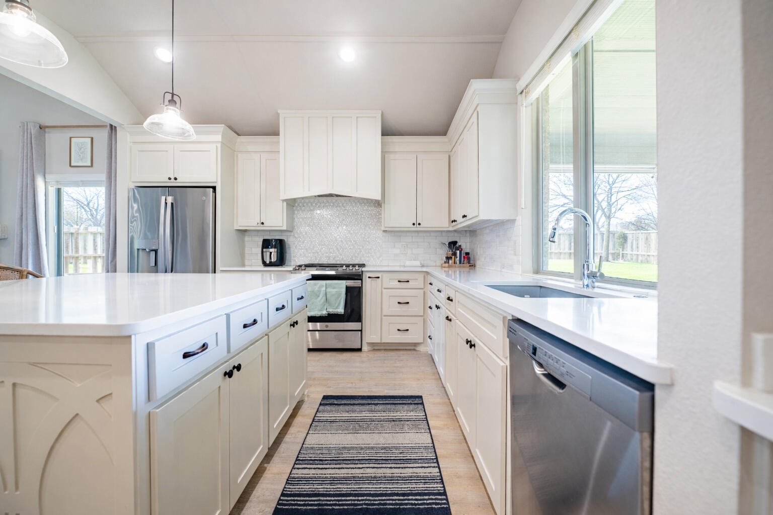3442 126th Street Lubbock, TX 79423 - Photo 44 of 53 a kitchen with stainless steel appliances a sink stove and cabinets