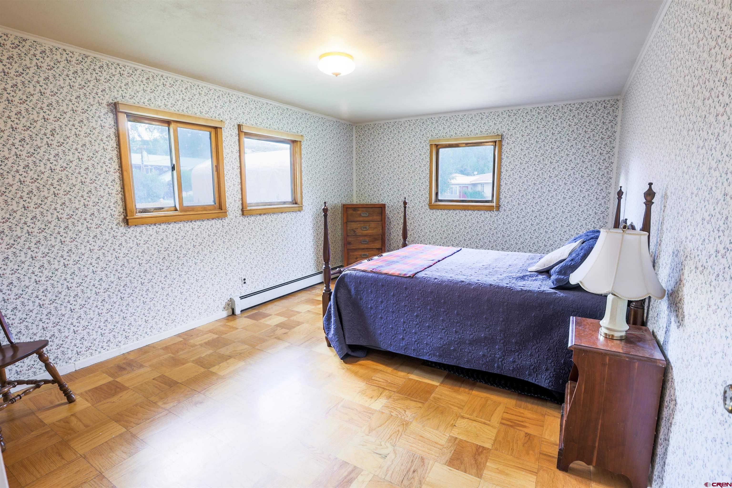 128 Bevington Road Gunnison, CO 81230 - Photo 14 of 37 a bedroom with a bed and a window