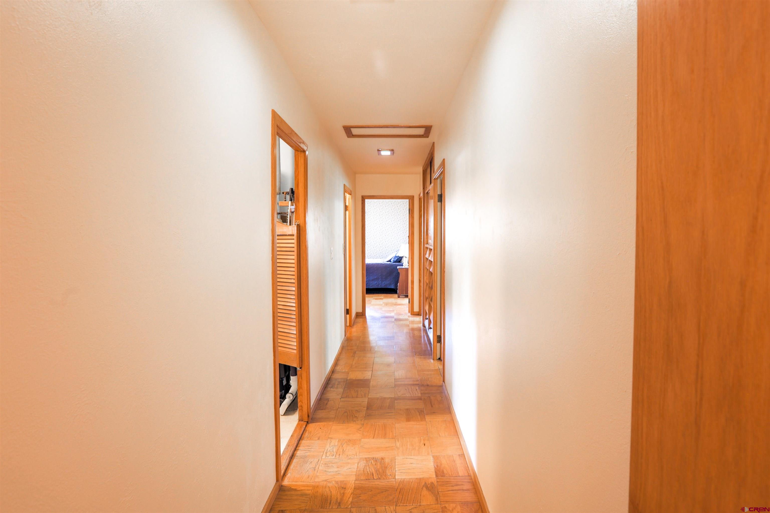 128 Bevington Road Gunnison, CO 81230 - Photo 8 of 37 a view of a hallway with wooden floor