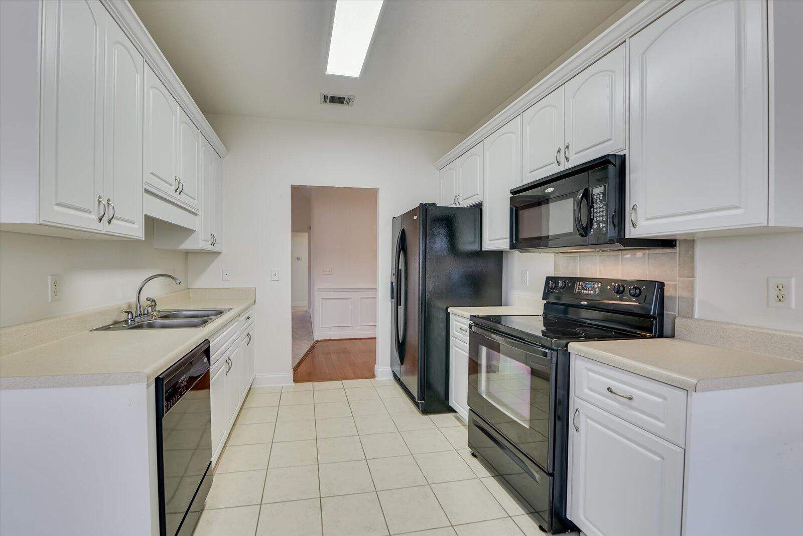 4598 Logans Way Augusta, GA 30909 - Photo 13 of 38 Loaded kitchen with refrigerator, stove, microwave, dishwasher, garbage disposal all on ceramic tile