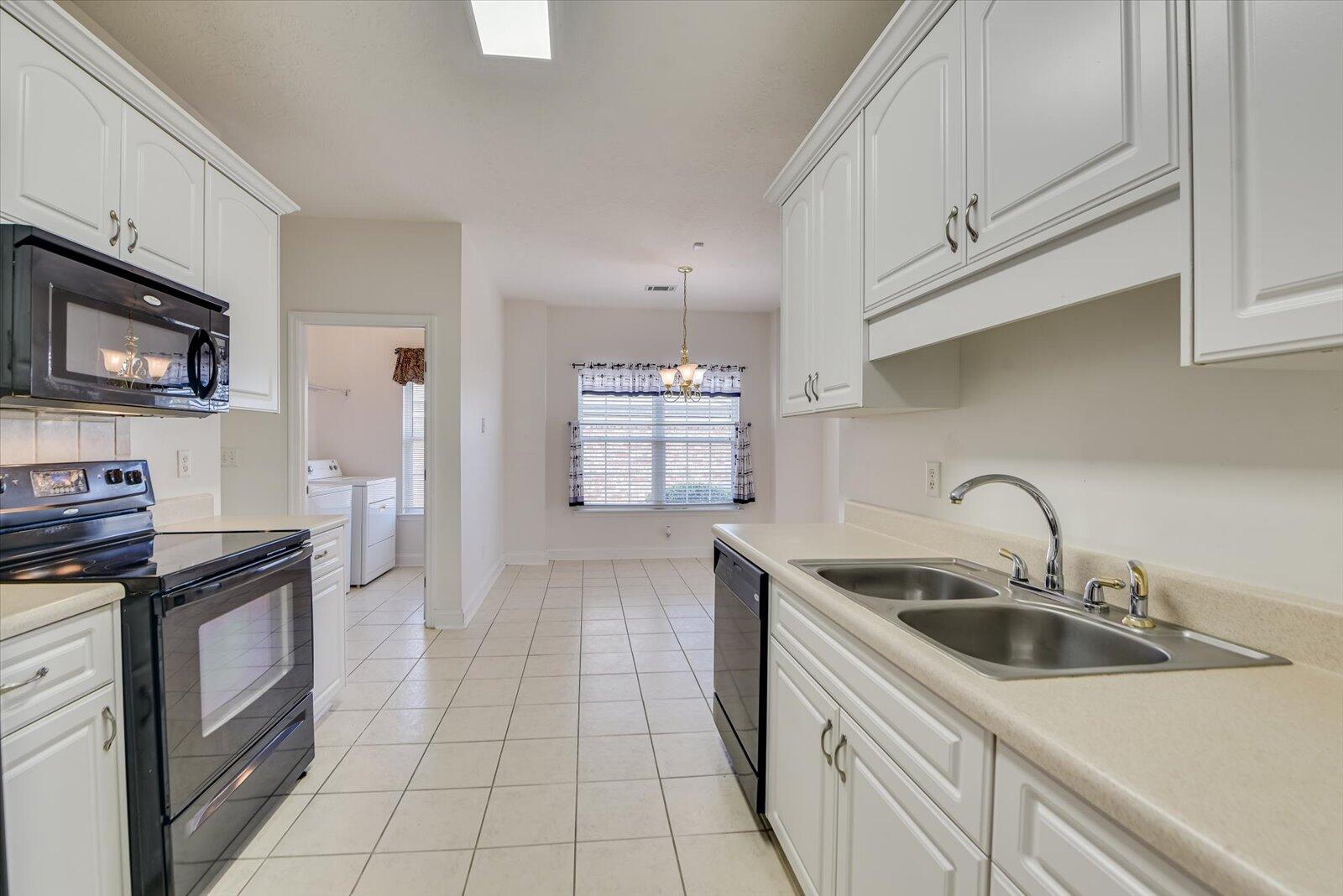 4598 Logans Way Augusta, GA 30909 - Photo 14 of 38 Plenty of cabinet and counter space with double sink an adjacent pantry