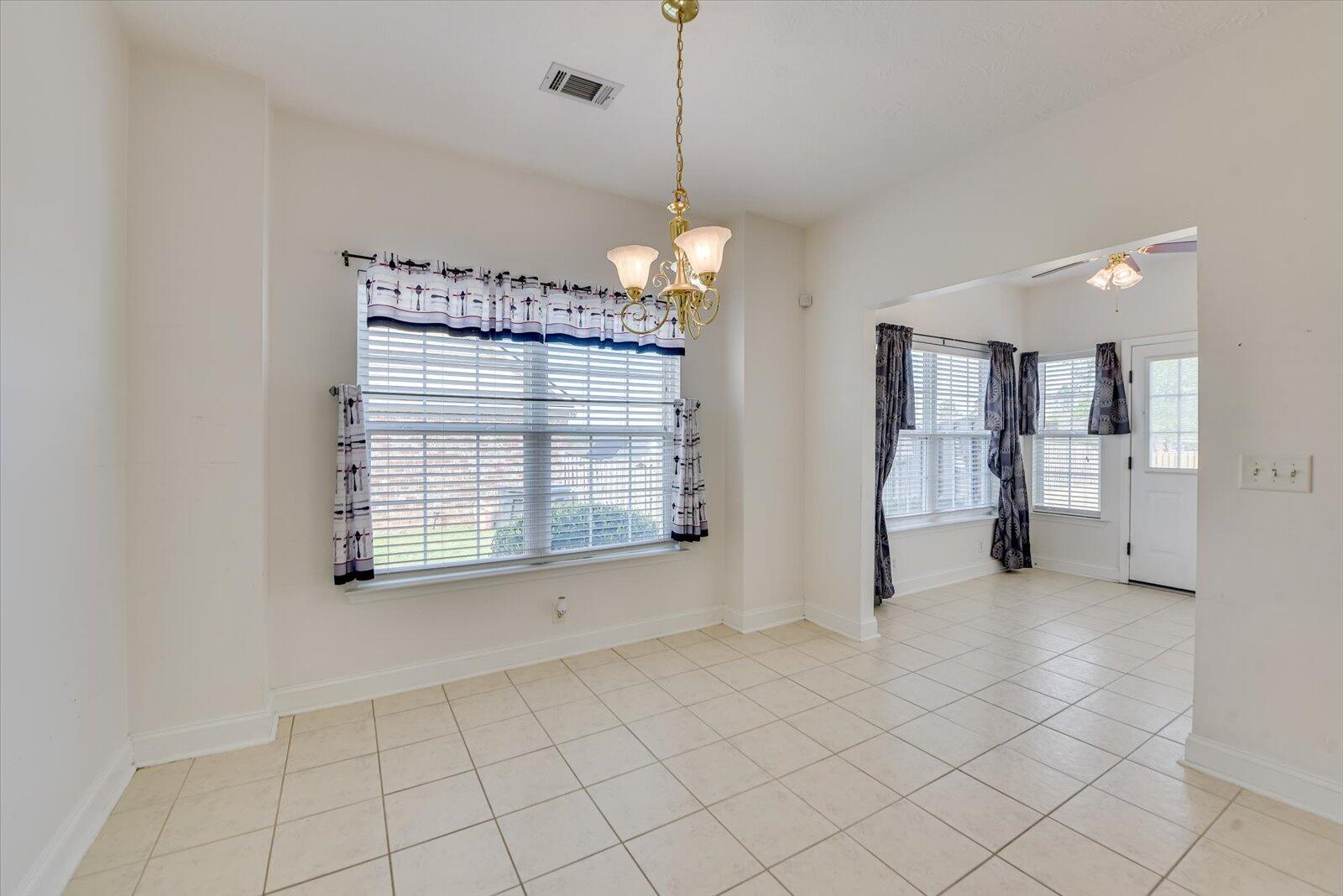 4598 Logans Way Augusta, GA 30909 - Photo 16 of 38 Eat-in kitchen for those quiet moments or chats with family or friends. Wood faux blinds is a plus