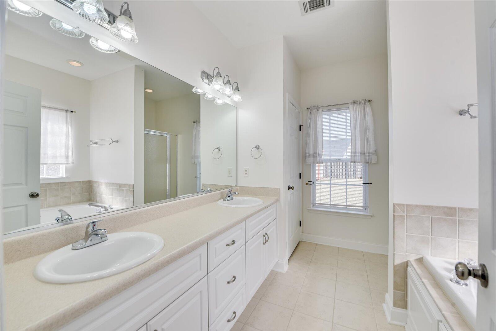 4598 Logans Way Augusta, GA 30909 - Photo 22 of 38 Owner's bath with double sinks and ceramic tile