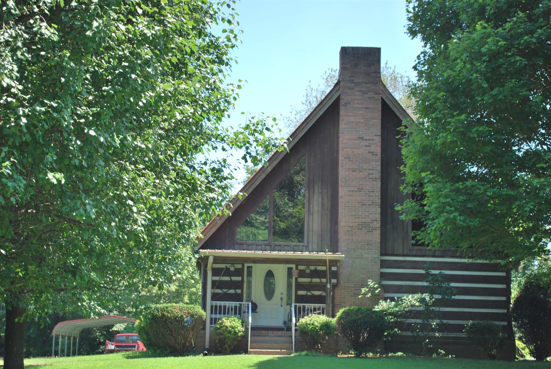 5729 Keysburg Road Adams, TN 37010 - Photo 1 of 30 a view of a yard in front of house