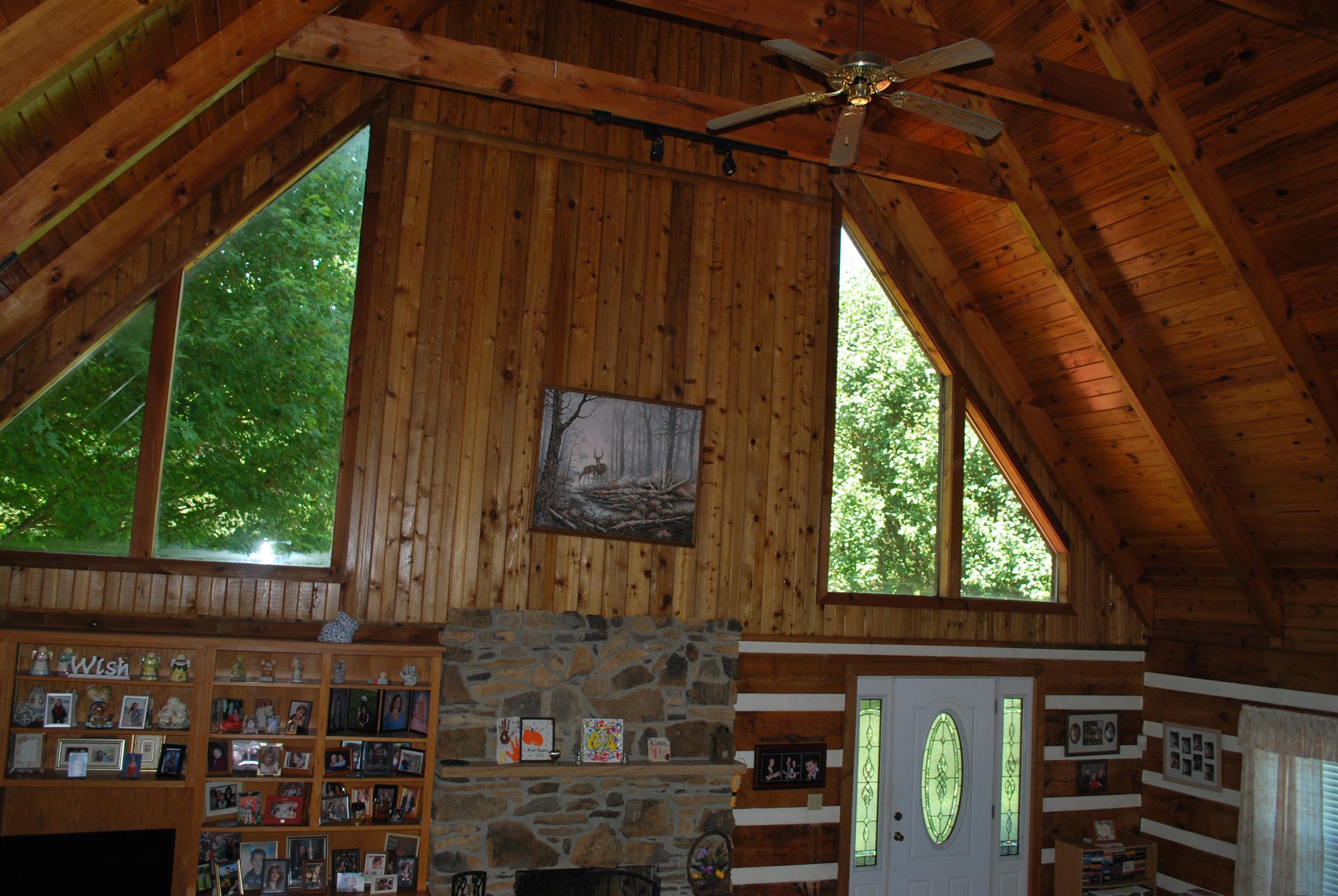 5729 Keysburg Road Adams, TN 37010 - Photo 12 of 30 a room with lots of wooden furniture and a porch