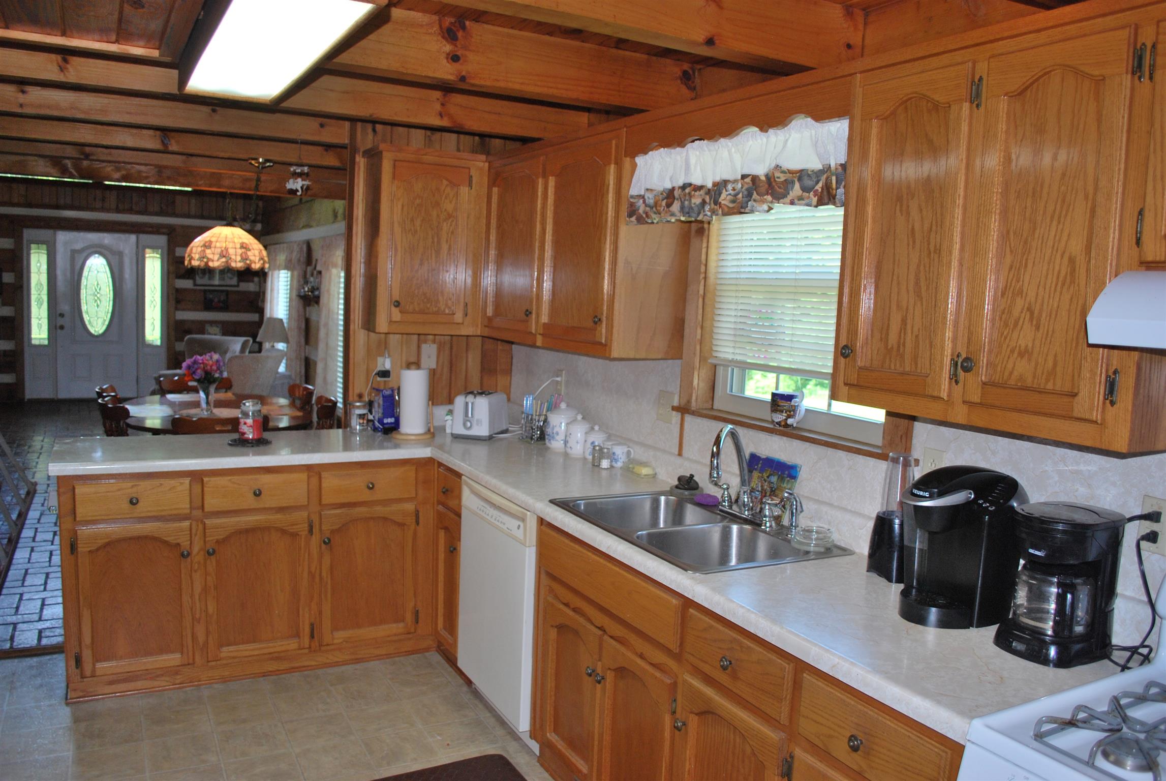 5729 Keysburg Road Adams, TN 37010 - Photo 18 of 30 a kitchen with a sink and cabinets
