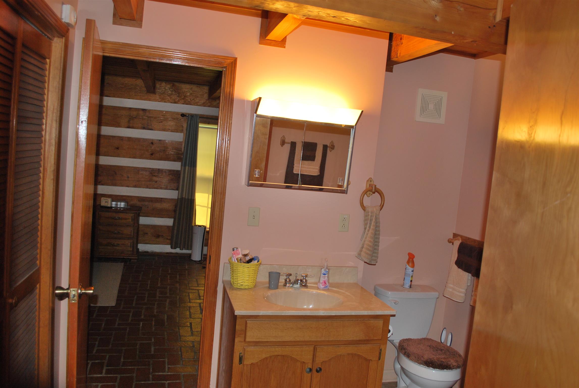 5729 Keysburg Road Adams, TN 37010 - Photo 25 of 30 a bathroom with a sink vanity and toilet