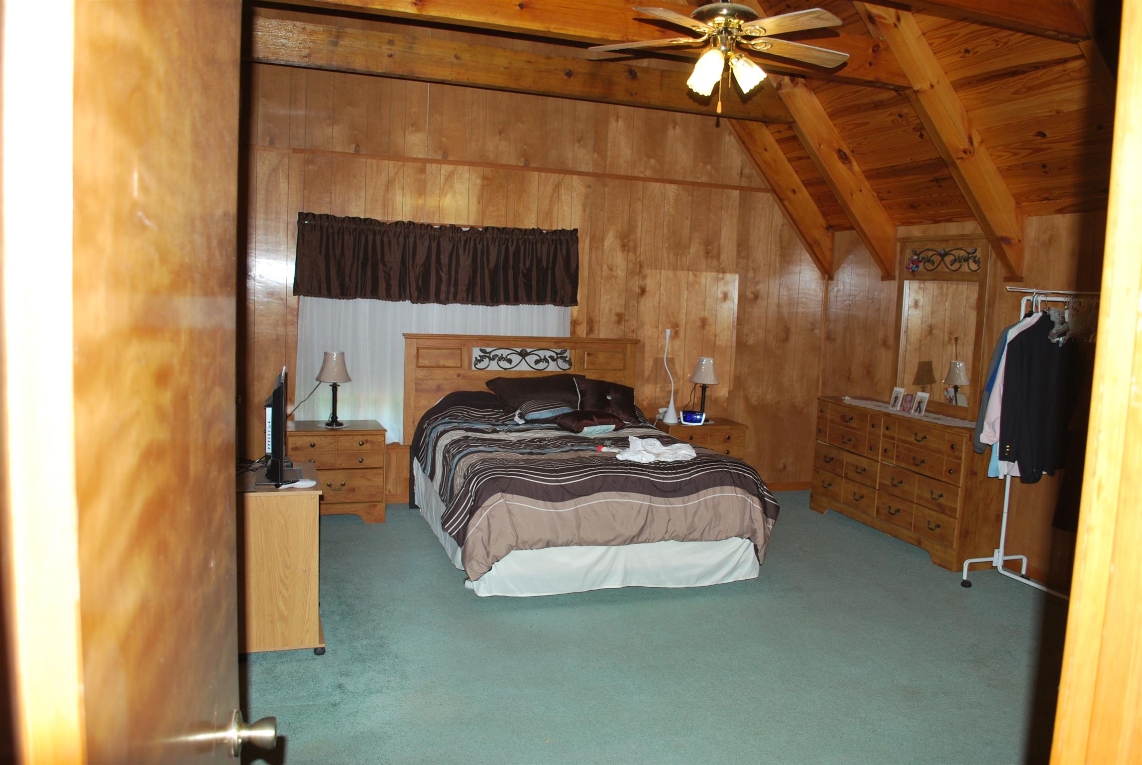 5729 Keysburg Road Adams, TN 37010 - Photo 26 of 30 a bedroom with a bed and a mirror