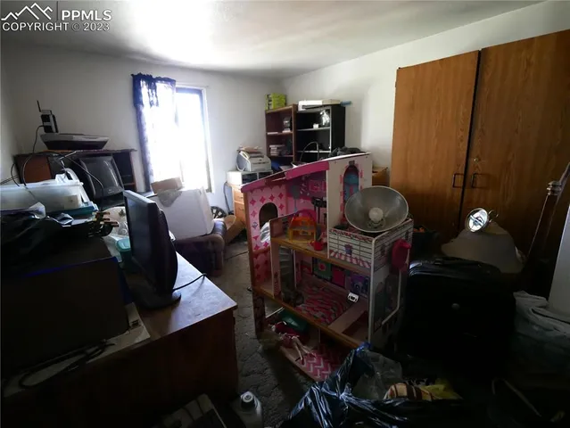 a bathroom with a granite countertop sink a toilet and a shower