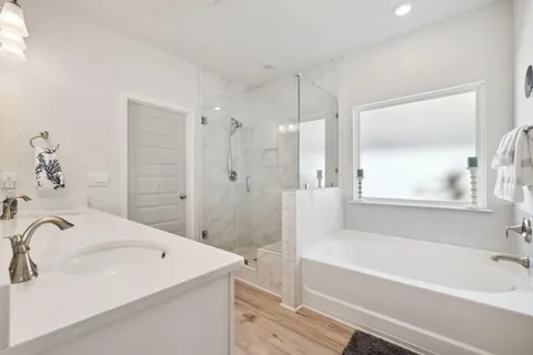 a bathroom with double sink and a mirror
