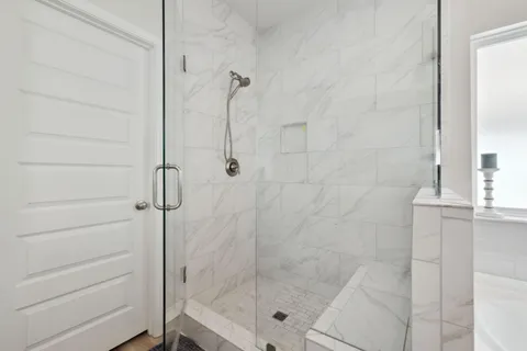 a white bath tub sitting next to a window