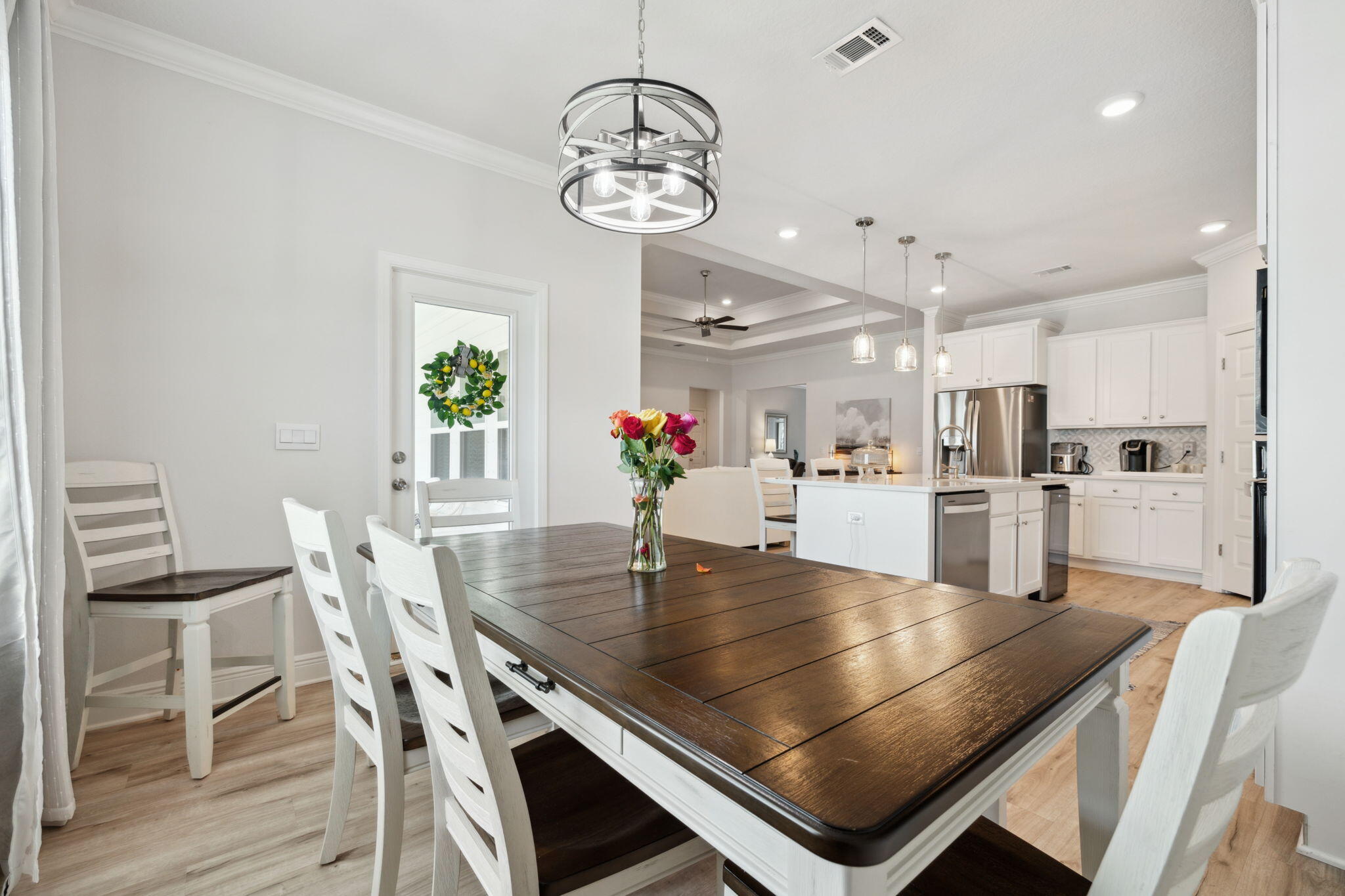 77 Palmview Lane Santa Rosa Beach, FL 32459 - Photo 15 of 37 a dining room with wooden floor and chandelier