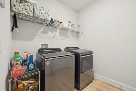 a bathroom with a sink toilet tub and shower