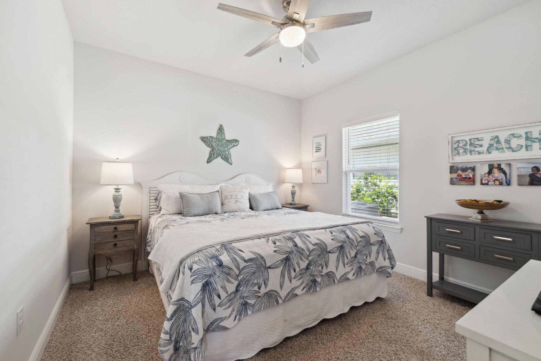 77 Palmview Lane Santa Rosa Beach, FL 32459 - Photo 20 of 37 a bedroom with a bed and a chandelier