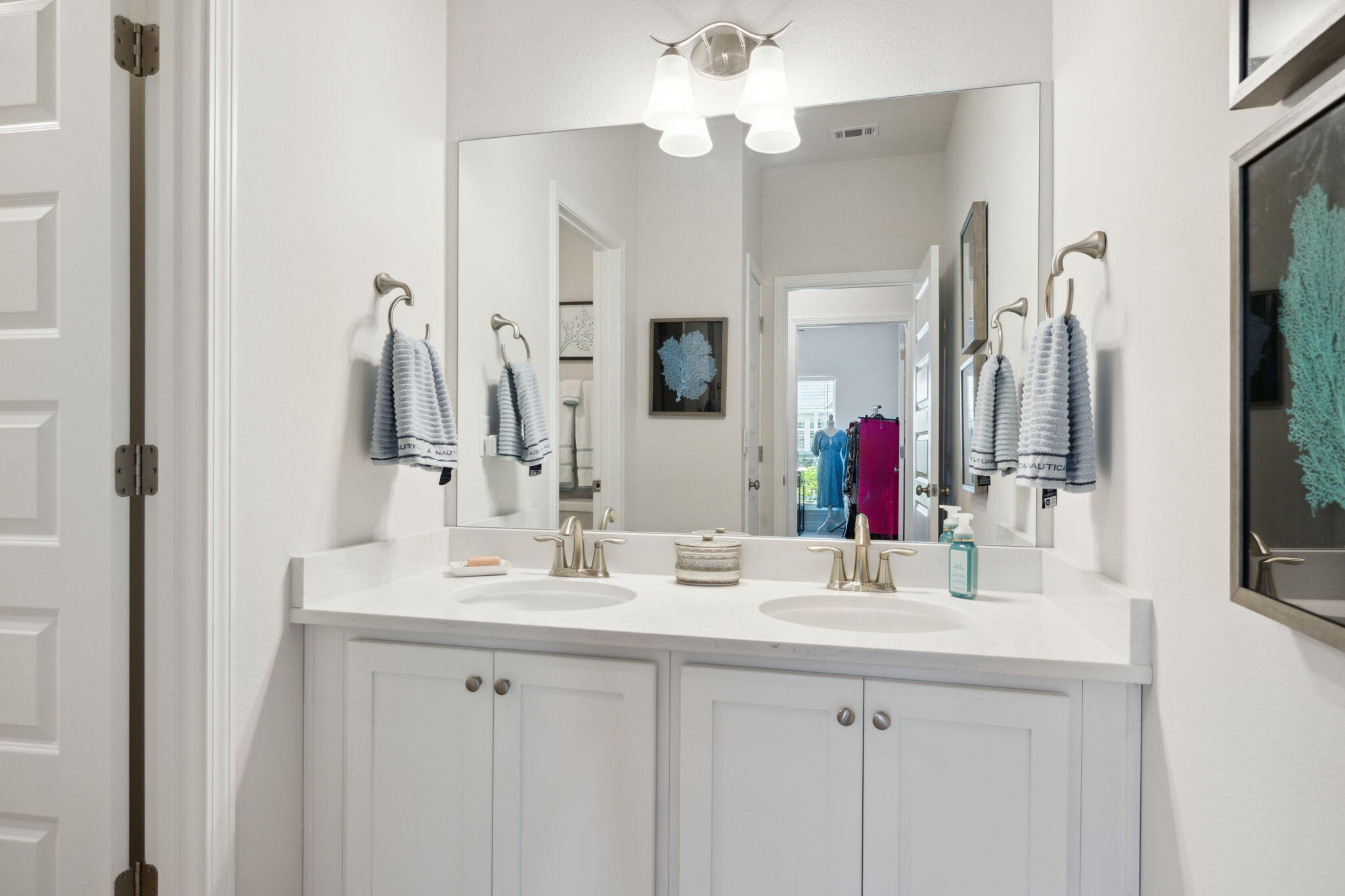 77 Palmview Lane Santa Rosa Beach, FL 32459 - Photo 21 of 37 a bathroom with a double vanity sink and a mirror