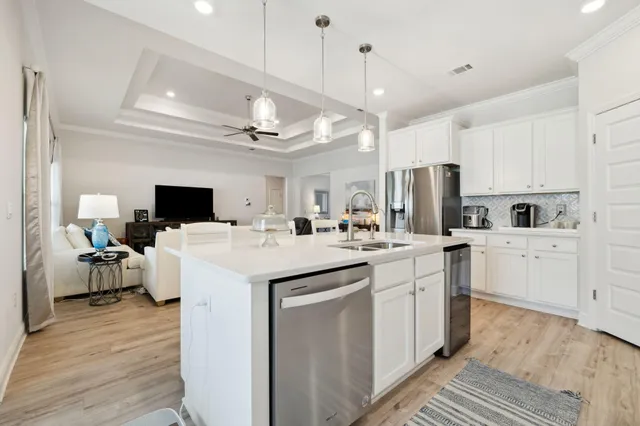 a kitchen with cabinets and stainless steel appliances
