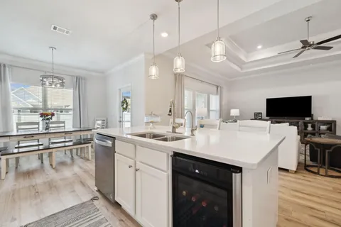a kitchen with sink stove and cabinets