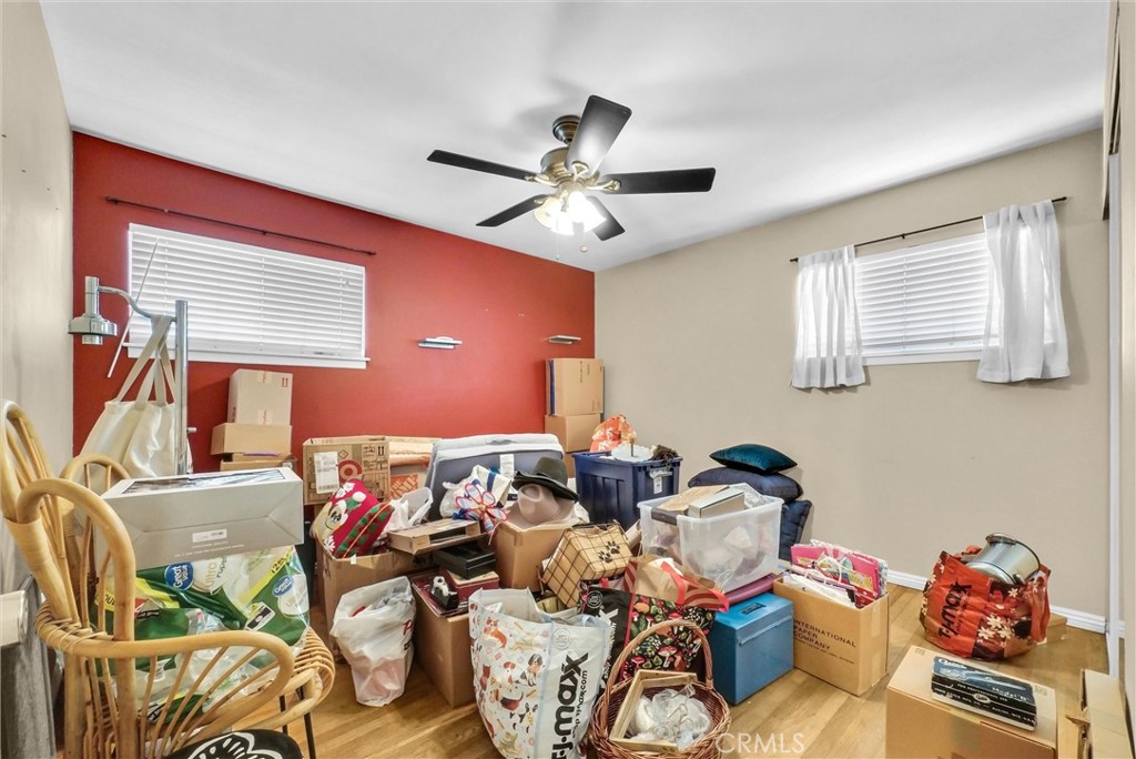2551 Rome Avenue Anaheim, CA 92804 - Photo 22 of 27 a bedroom with furniture and a chandelier fan