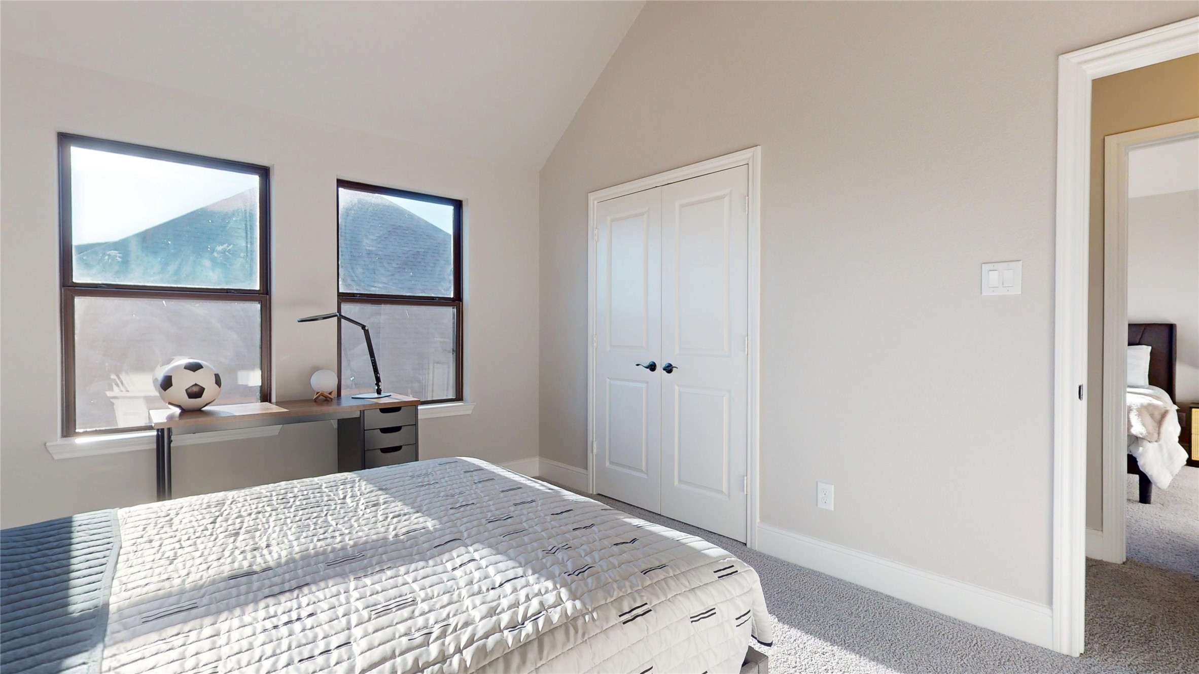 8305 Greenleaf Ridge Way Conroe, TX 77385 - Photo 29 of 33 a bedroom with a bed and a dresser with mirror